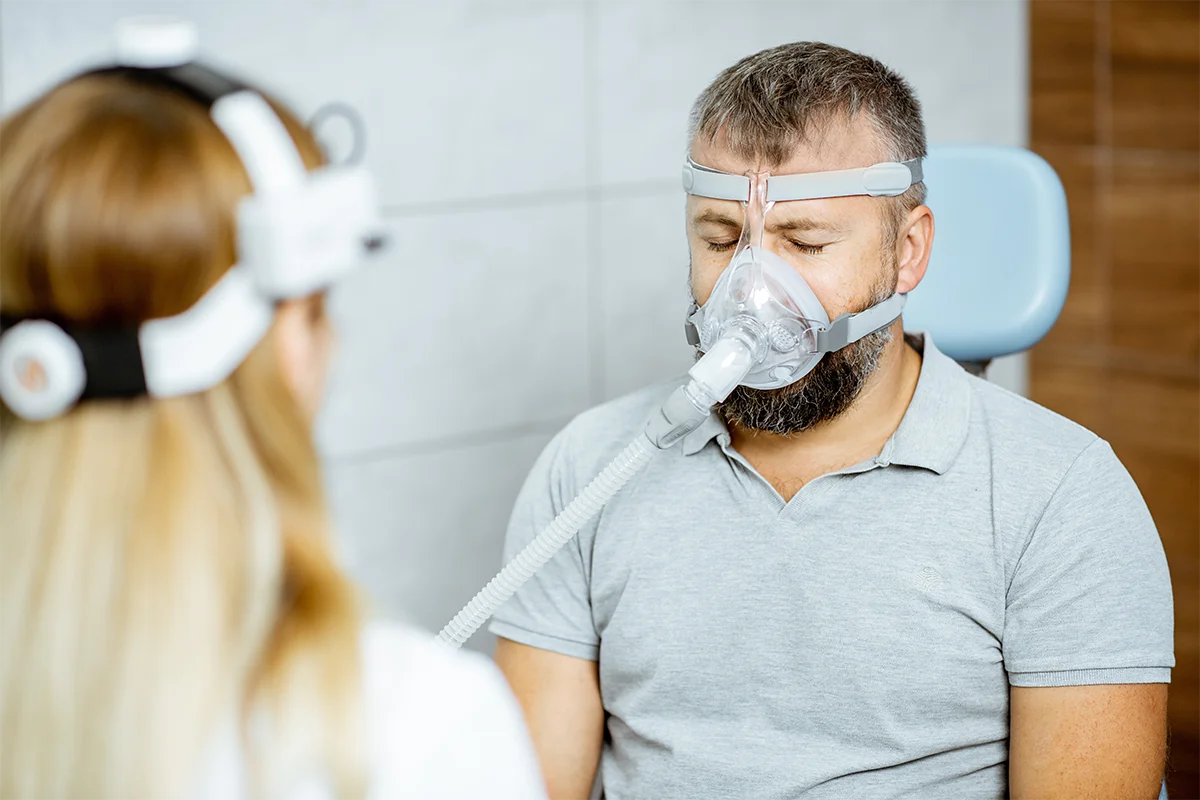 Assisting man with Cpap